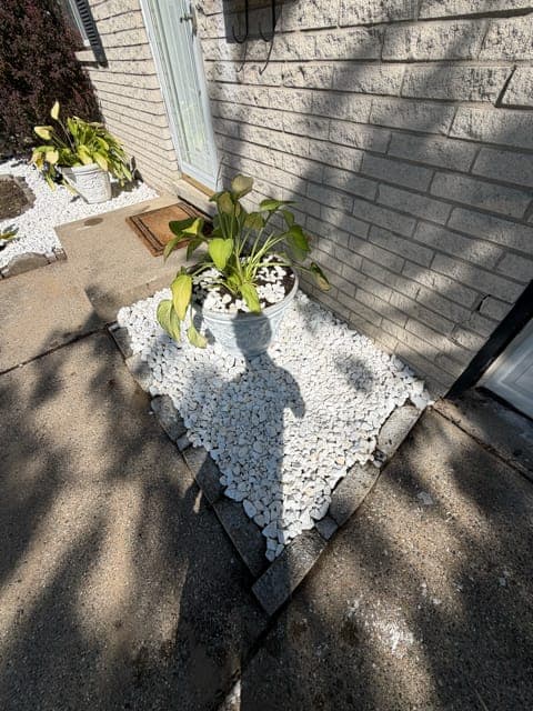 Side Entry Bed — Marble White Rock Install — after, by Heights Yard Solutions